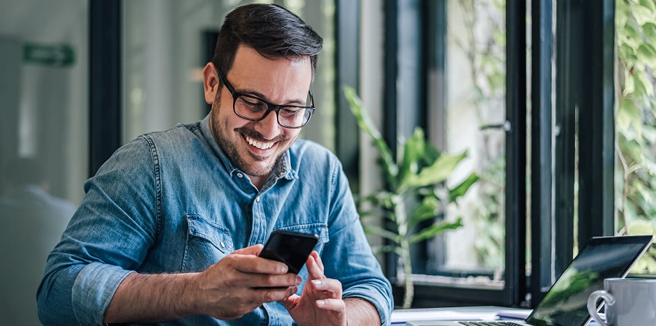 Man browses the internet on his cell phone