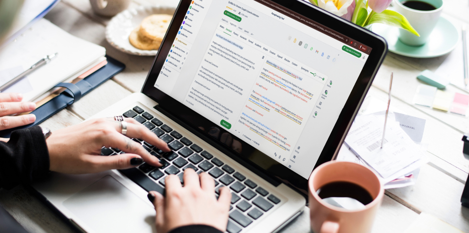 Person typing on a laptop at their desk