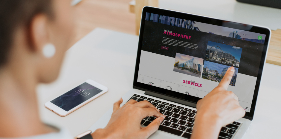 Woman views a real estate website on her laptop