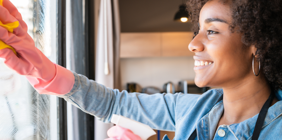 Woman cleaning up window