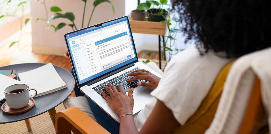 woman typing on her laptop