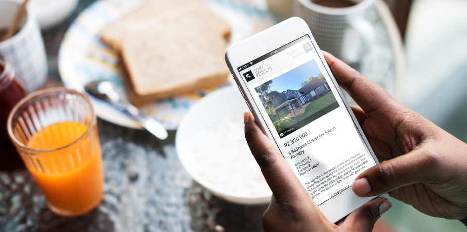 Browsing a mobile phone and looking at a real estate website